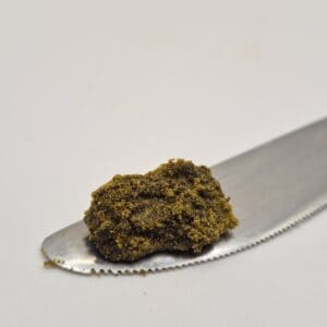Brown crumbly hash on metal spatula