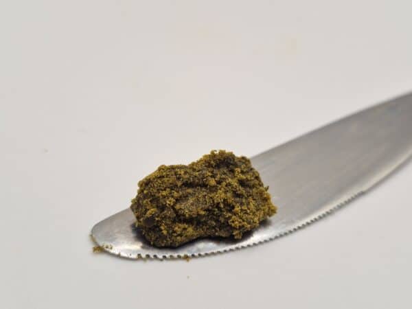 Brown crumbly hash on metal spatula