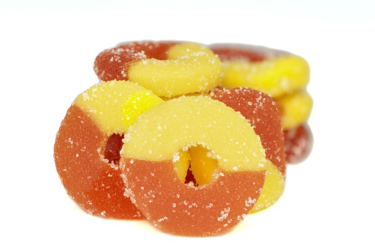 Peach-flavored gummy candy rings, sugar-coated.